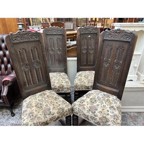 101 - Four 17th century style carved oak and tapestry upholstered dining chairs