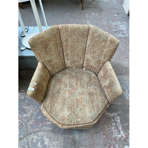 109 - A mid 20th century fabric upholstered fan back arm chair