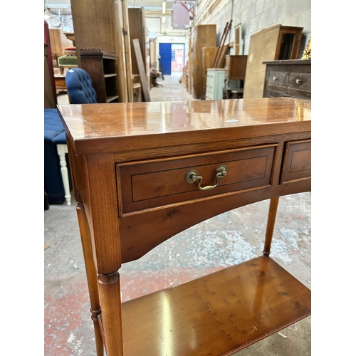 11 - A Bradley yew wood two drawer side table - approx. 76cm high x 66cm wide x 32cm deep