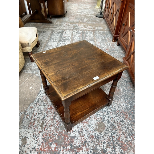 119 - A 17th century style solid oak two tier side table with turned supports - approx. 46cm high x 53cm w... 