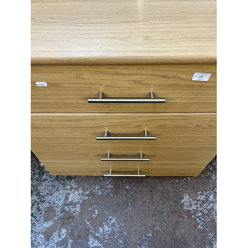 125 - A modern oak effect chest of drawers - approx. 75cm high x 75cm wide x 40cm deep