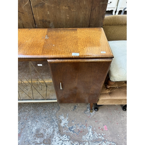 127 - A mid 20th century oak display cabinet with two glass sliding doors - approx. 82cm high x 120cm wide... 