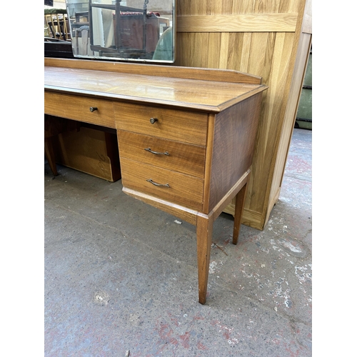 136 - A mid 20th century Alfred Cox walnut two piece bedroom suite comprising chest of drawers - approx. 9... 