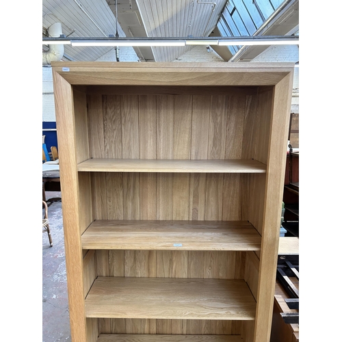 137 - A modern oak four tier open bookcase - approx. 184cm high x 90cm wide x 38cm deep