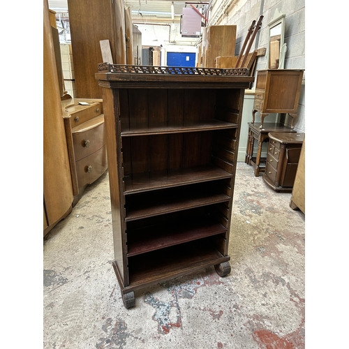 14 - A Victorian style mahogany five tier bookcase with fretwork galleried top - approx. 101cm high x 58c... 