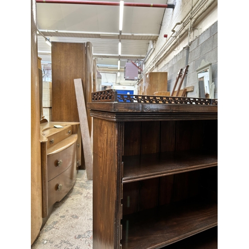 14 - A Victorian style mahogany five tier bookcase with fretwork galleried top - approx. 101cm high x 58c... 