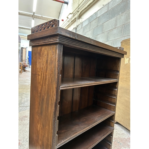 14 - A Victorian style mahogany five tier bookcase with fretwork galleried top - approx. 101cm high x 58c... 