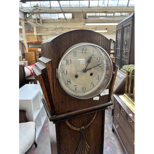 142 - An Art Deco Haller oak cased grandmother clock with pendulum - approx. 156cm high