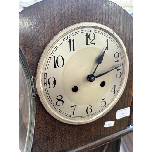 142 - An Art Deco Haller oak cased grandmother clock with pendulum - approx. 156cm high