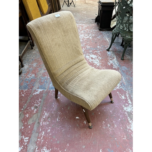 149 - A mid 20th century brown fabric upholstered and beech slipper lounge chair