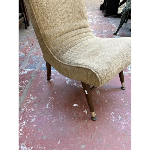 149 - A mid 20th century brown fabric upholstered and beech slipper lounge chair