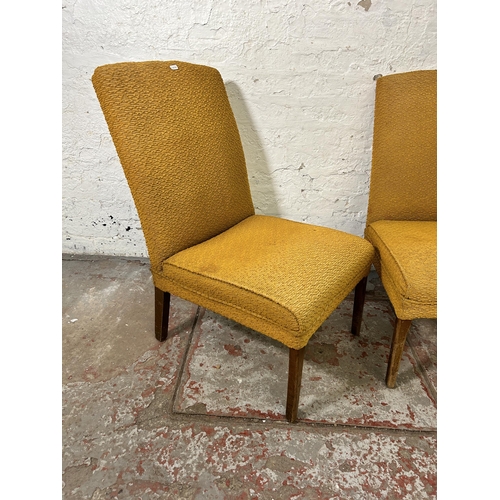 154 - A pair of mid 20th century yellow fabric upholstered bedroom chairs