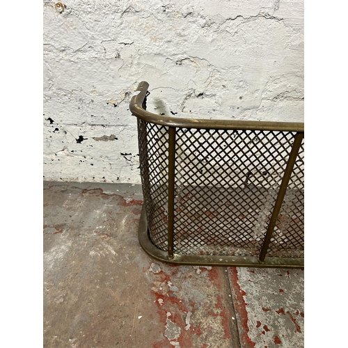 166 - A late 19th/early 20th century meshed brass fire fender - approx. 33cm high x 110cm wide