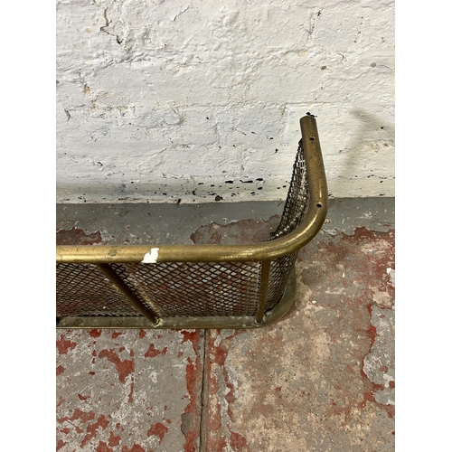 166 - A late 19th/early 20th century meshed brass fire fender - approx. 33cm high x 110cm wide