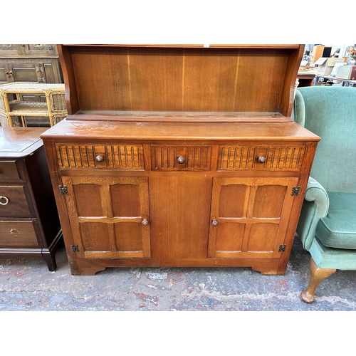 172 - An oak dresser - approx. 184cm high x 122cm wide x 40cm deep