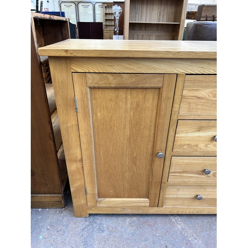 178 - A modern oak sideboard - approx. 95cm high x 147cm wide x 45cm deep