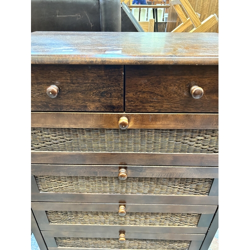 18 - A modern hardwood and wicker chest of drawers - approx. 105cm high x 81 cm wide x 48 cm deep