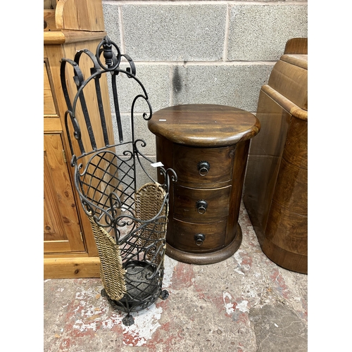 2 - Two pieces of furniture, one wrought iron and wicker umbrella stand and one Indian sheesham wood cyl... 