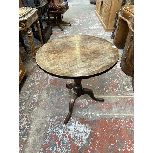 20 - A Georgian mahogany circular tilt top tripod occasional table - approx. 109cm high x 68cm diameter