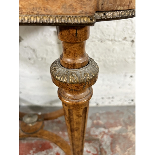 23 - A 19th century French marquetry inlaid amboyna planter side table with gilt metal decoration and flu... 