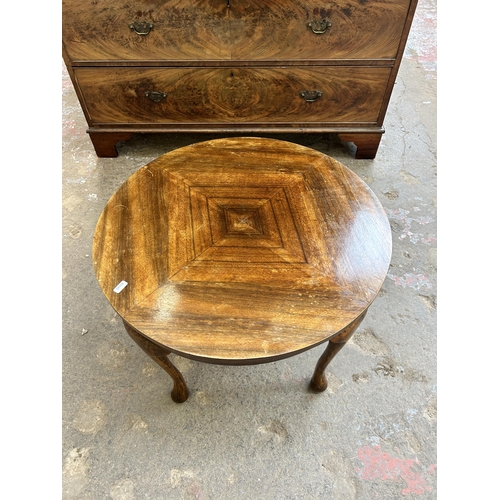 31 - A walnut circular coffee table on cabriole supports - approx. 46cm high x 60cm diameter