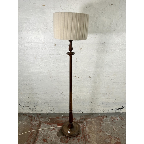 33 - A 19th century style mahogany standard lamp with circular base - approx. 166cm high