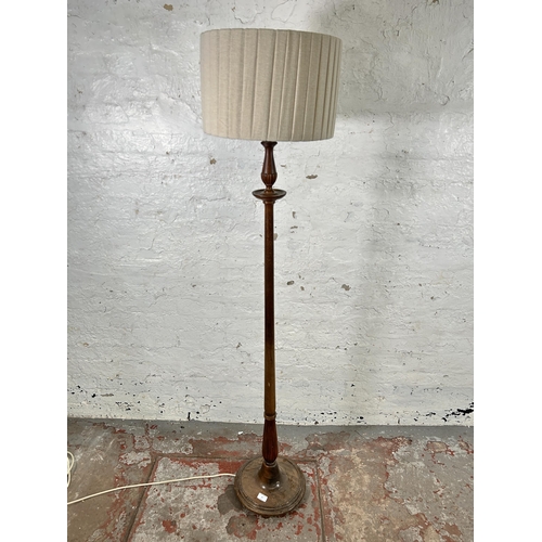 33 - A 19th century style mahogany standard lamp with circular base - approx. 166cm high