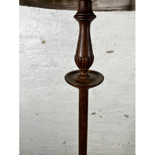 33 - A 19th century style mahogany standard lamp with circular base - approx. 166cm high