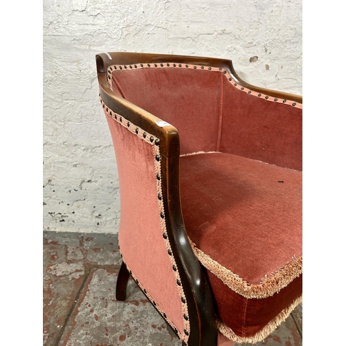 46 - An Edwardian beech and pink fabric upholstered armchair