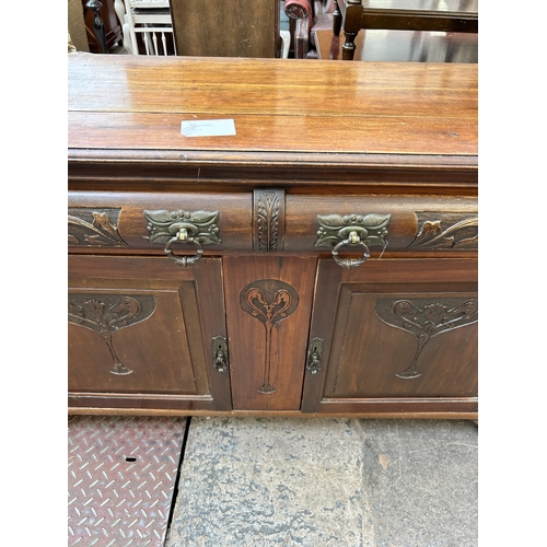 54 - An Edwardian carved mahogany sideboard - approx. 90cm high x 131cm wide x 46cm deep