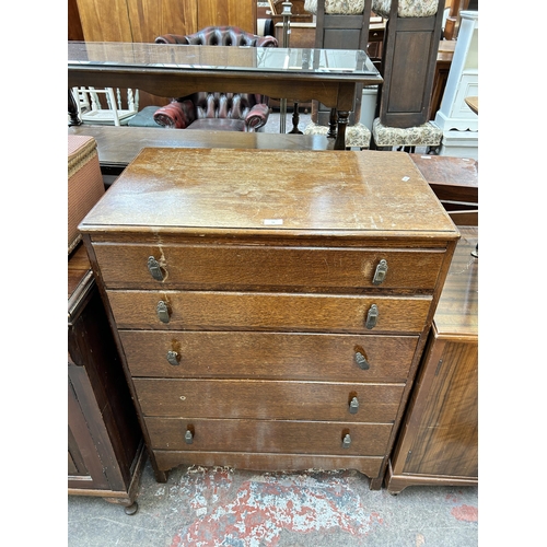 56 - A mid 20th century oak chest of drawers - approx. 101cm high x 77cm wide x 46cm deep