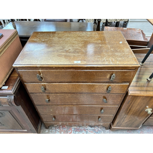 56 - A mid 20th century oak chest of drawers - approx. 101cm high x 77cm wide x 46cm deep