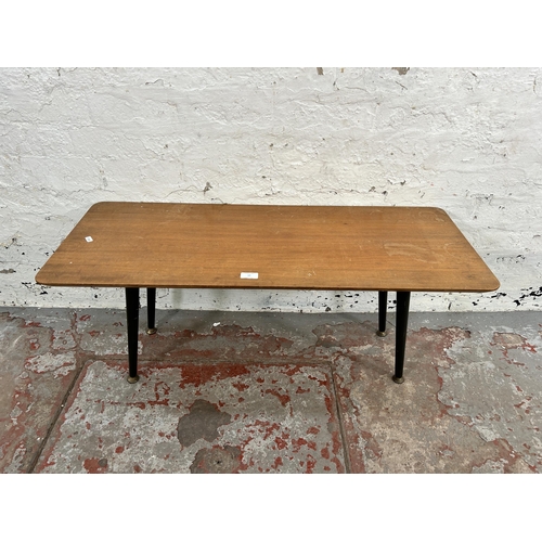 57 - A mid 20th century teak and ebonised rectangular coffee table