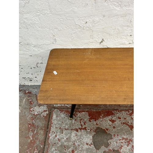 57 - A mid 20th century teak and ebonised rectangular coffee table