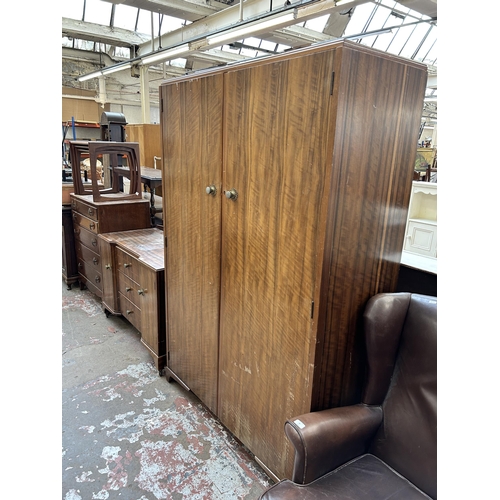 58 - A Denby & Spinks Ltd Leeds & Harrogate walnut dressing table and double wardrobe