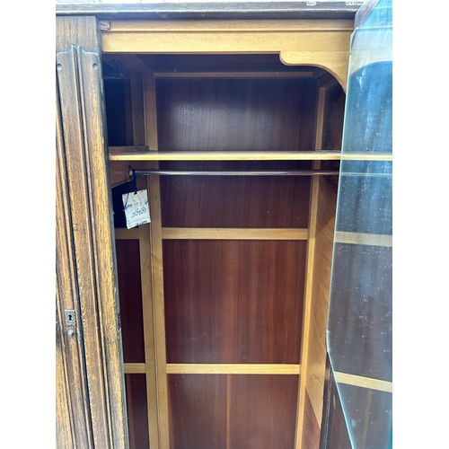 60 - Two mid 20th century oak his and hers double wardrobes, one - approx. 156cm high x 93cm wide x 44cm ... 