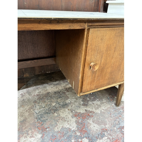 63 - A mid 20th century Meredew oak pedestal desk - approx. 71cm high x 122cm wide x 51cm deep