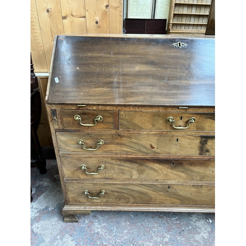 65 - A George III mahogany bureau on bracket supports - approx. 107cm high x 122cm wide x 55cm deep