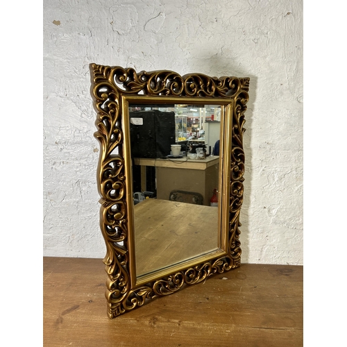 7 - A gilt framed bevelled edge wall mirror - approx. 82cm high x 60cm wide