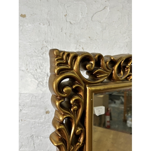 7 - A gilt framed bevelled edge wall mirror - approx. 82cm high x 60cm wide