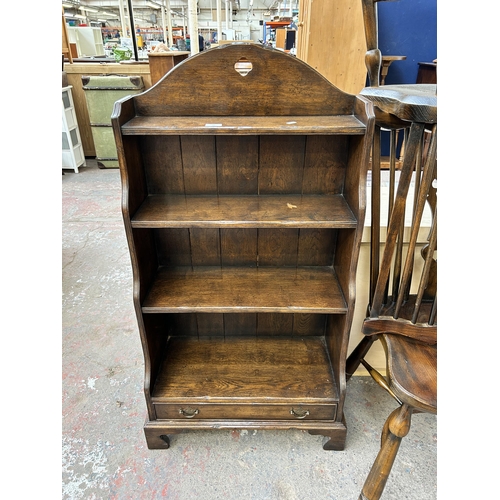 72 - A Georgian style solid oak four tier waterfall bookcase on bracket supports - approx. 117cm high x 6... 