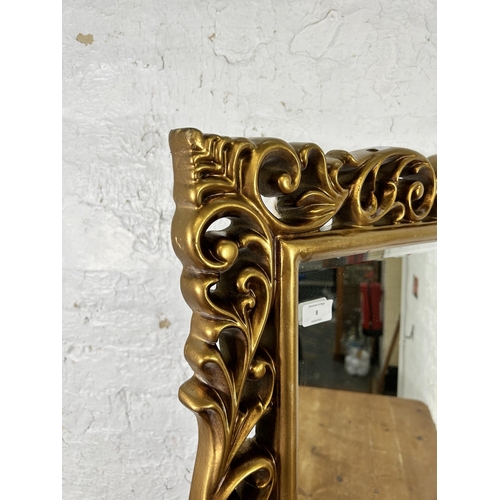 8 - A gilt framed bevelled edge wall mirror - approx. 82cm high x 60cm wide