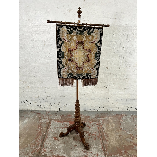 81 - A Victorian walnut tapestry and beadwork pole screen on tripod pedestal support  - approx. 146cm hig... 