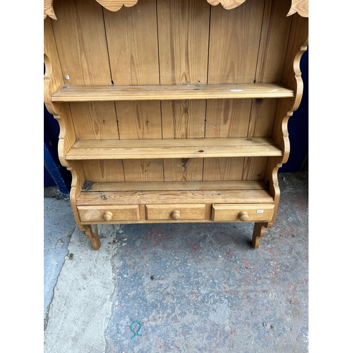 82 - A pine wall mountable three tier plate rack - approx. 113cm high x 86cm wide x 20cm deep