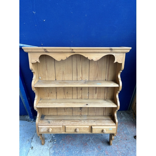 82 - A pine wall mountable three tier plate rack - approx. 113cm high x 86cm wide x 20cm deep