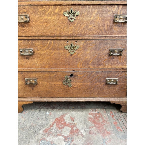 83 - A Georgian oak chest of drawers on bracket supports  - approx.  103cm high x 97cm wide x 55cm deep