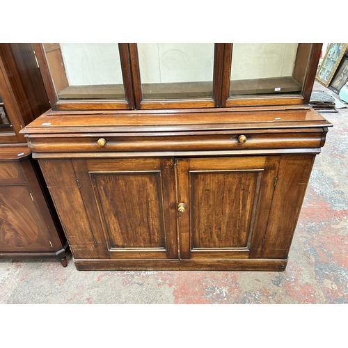 95 - A Victorian mahogany bookcase with three upper glazed doors - approx. 185cm high x 141cm wide x 46cm... 