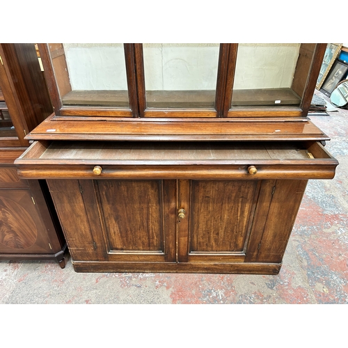 95 - A Victorian mahogany bookcase with three upper glazed doors - approx. 185cm high x 141cm wide x 46cm... 