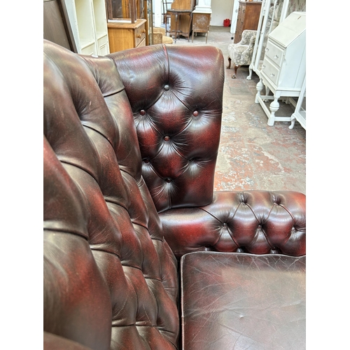 99 - An ox blood leather Chesterfield wingback armchair on cabriole supports