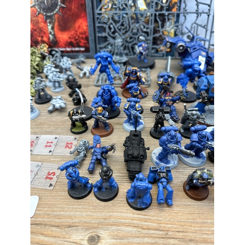 466 - A large collection of Warhammer 40K miniatures and accessories to include Space marines, Death guard... 